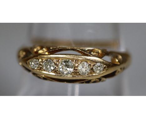 18ct gold and diamond five stone ring. Ring size R. Approx weight 2.9 grams. (B.P. 21% + VAT)&nbsp;&nbsp;One stone is a bit c