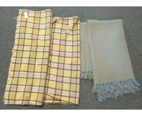 Three vintage woollen blankets to include; two matching mustard ground check blankets and one blue ground honeycomb blanket. 