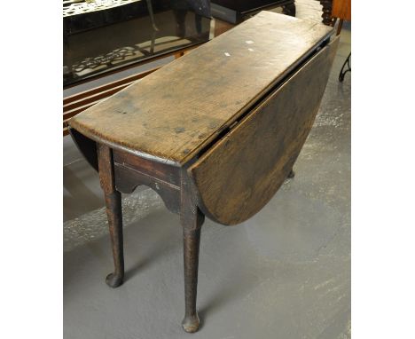 18th century oak gate leg table with shaped sides on pad feet. (B.P. 21% + VAT)