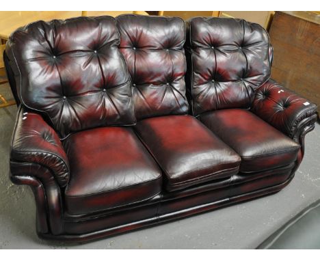 Modern leather Chesterfield style oxblood three seater sofa. (B.P. 21% + VAT) 