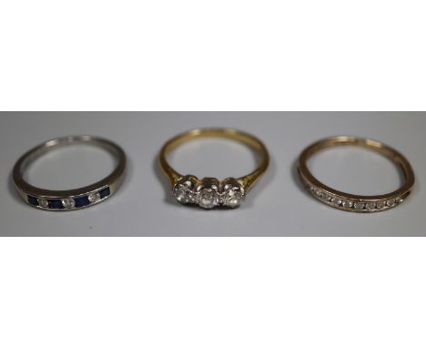 18ct gold three stone diamond ring.  Ring size R and two 9ct gold diamond set half eternity style rings.  Ring size Q and R. 