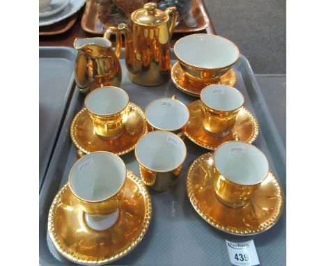 Royal Worcester gold coloured coffee set comprising: coffee pot, milk jug and sugar basin with six cups and saucers. (B.P. 21