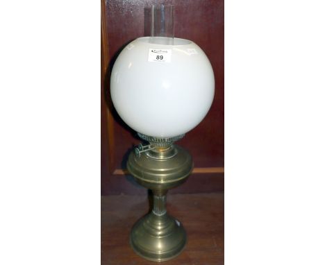 20th century brass double burner oil lamp with opaque glass shade and clear chimney.(B.P. 21% + VAT) 