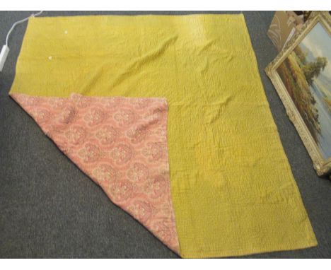 Vintage cotton quilt, one side floral design on a pink ground and the other plain mustard ground.(B.P. 21% + VAT) 