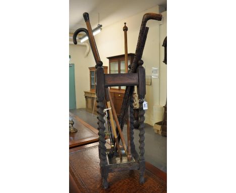 Early 20th Century oak barley twist stick and umbrella stand, comprising various carved and other walking sticks. (B.P. 21% +