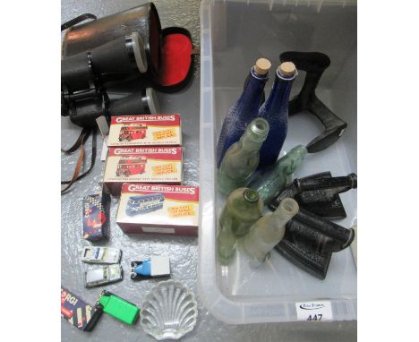 Box of assorted items to include: two flat irons, vintage glass bottles including two cod bottles, a shoe last, Corgi cars, '