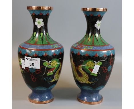 Pair of Chinese black ground cloisonne baluster shaped vases depicting dragons chasing flaming pearls. 24 cm high approx. (2)