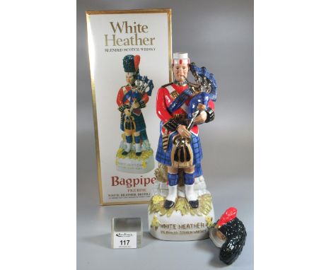 White Heather blended Scotch whisky bagpiper figurine/decanter in original box. Full and sealed. (B.P. 21% + VAT)Head is deta