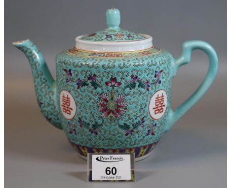 Modern Chinese porcelain teapot decorated with stylised lotus and shou roundles on a turquoise blue ground with in key fret b