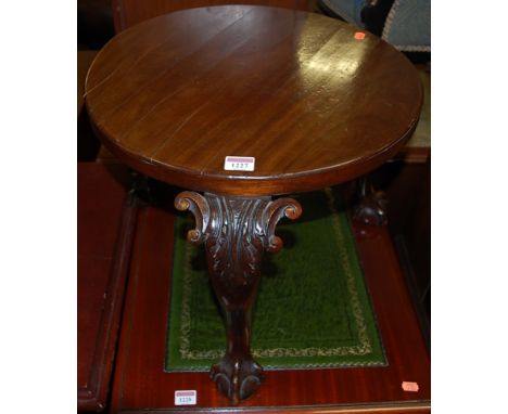 A circular mahogany low lamp table, raised on acanthus leaf carved cabriole supports, dia. 47cm
