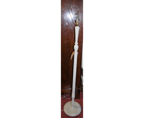 A white-washed fluted standard lamp