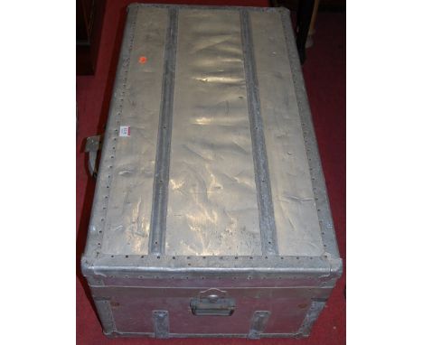 An early 20th century aluminium clad luggage trunk, w.86cm