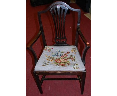 A 19th century mahogany Hepplewhite style single elbow chair, having tapestry upholstered drop-in pad seat