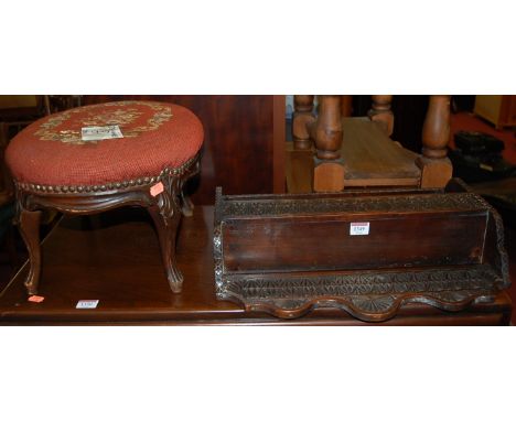 An early 20th century low relief carved oak small two-tier wall shelf, width 47cm, together with a tapestry upholstered low o