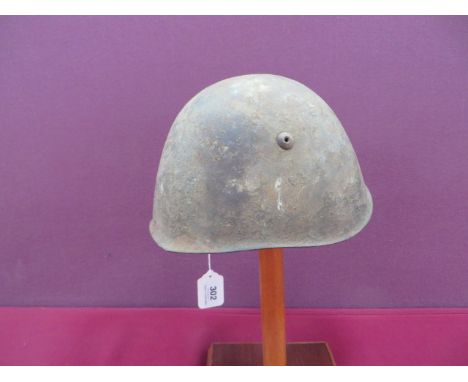 Italian Model 1933 Steel Helmet khaki painted outer shell. Leather eight tongue liner with alloy mounted chinstrap points. So