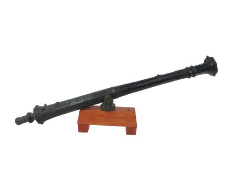 North Borneo Bronze Lantaka Cannon 36 inch cast darkened bronze cannon.  Flared floral muzzle with triangular geometric decor