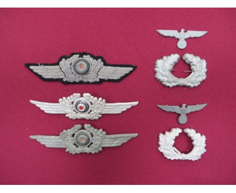 Selection of German Cap Badges consisting 2 x alloy Luftwaffe winged wreath with central cockade ... Alloy embroidery Luftwaf