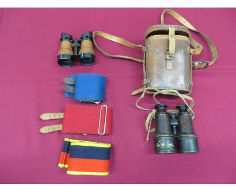 Pair of WW1 Officer's Field Binoculars blackened brass extendable lenses. Leather covered body. Body stamped with broad arrow