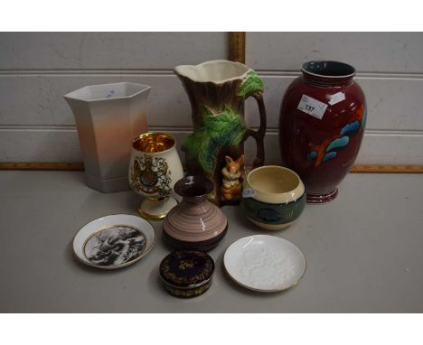 A Poole volcano vase together with other pottery