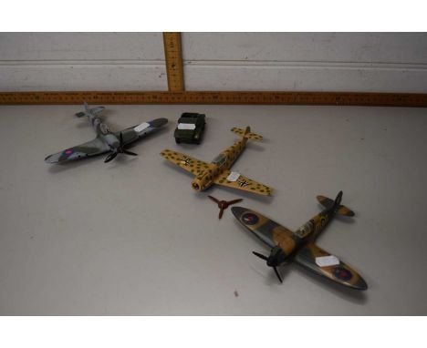 Three Dinky toy aeroplanes and a scout car