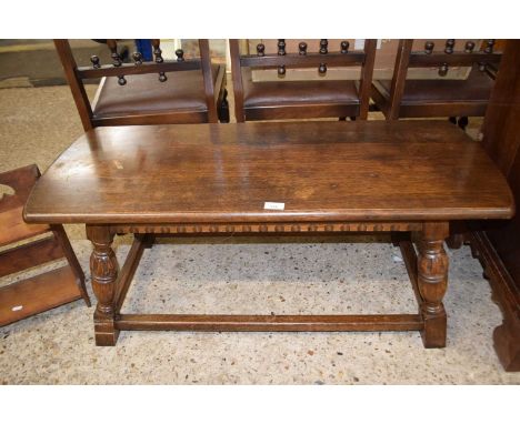 Bench/coffee table with angle turned legs united by stretchers, approx 100cm wide