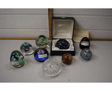 Eight assorted glass paperweights to include Caithness