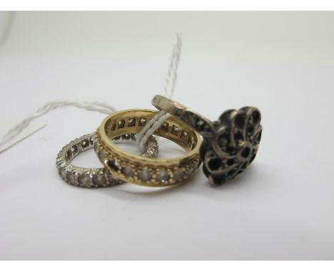 An Eternity Band, (stones missing) together with another eternity band (finger sizes K) and another ring. (3)