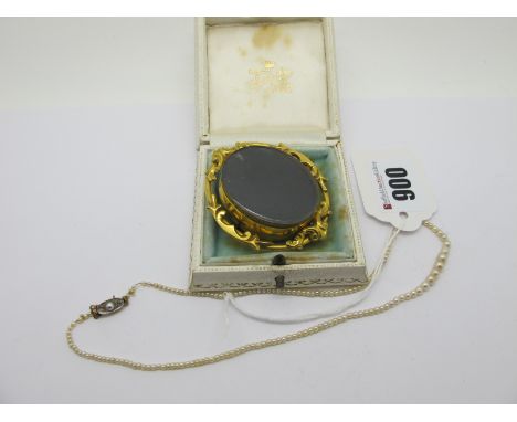 A XIX Century Oval Swivel Locket Brooch, glazed front and verso, within scroll mount; a dainty single strand graduated pearl 