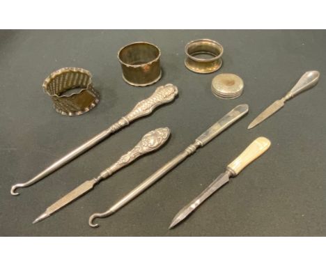 Silver - a late Victorian silver hafted button hook, Birmingham 1899; others;  napkin rings, nail files etc, 5.4oz gross 