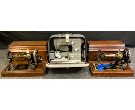 A Pfaff 360 vintage electric sewing machine, with original case;  two vintage Singer mechanical sewing machines, walnut cases