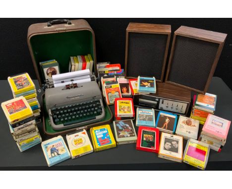 Vintage Technology - an Amerex stereo 8 cassette player, approx 60 cassettes;  a Remington Quiet Riter portable typewriter. 