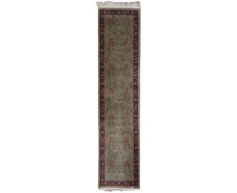 Hereke Wool Runner  Hand knotted, cotton backed having and abstract floral pattern in hues of wine, white, gold and blue on a