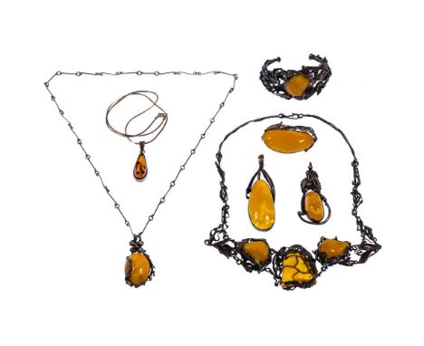 Sterling Silver and Amber Jewelry Assortment  (8) items including (3) necklaces, a cuff bracelet, (2) pendants and a brooch; 