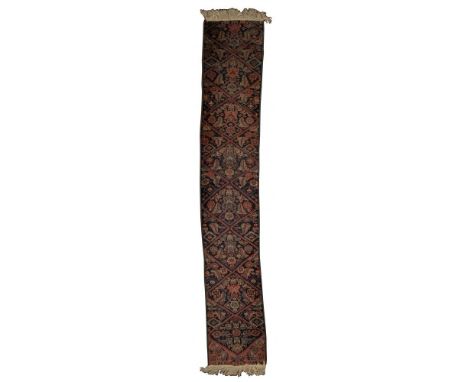Persian Wool Runner Rug  Having an abstract geometric pattern in hues of rust, green, cream and tan on blue field; having fri