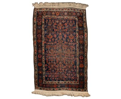 Persian Wool Kilim Rug  Having an abstract geometric pattern in hues of red, white, mauve and light blue on a dark blue field