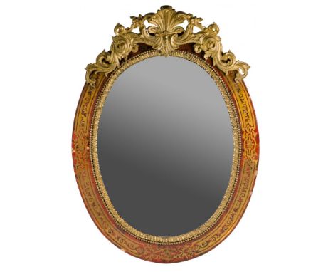 Boulle Style Wall Mirror  Having a beveled mirror in a wood frame decorated with tortoiseshell style veneer with ornate brass