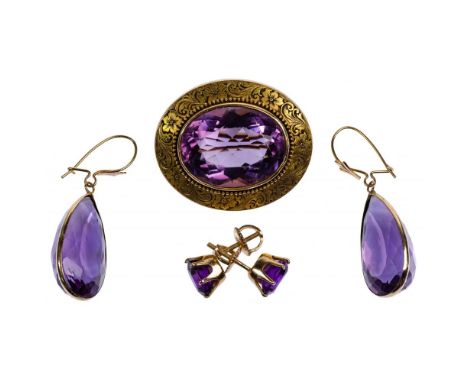 Gold and Amethyst Jewelry Assortment  (3) items including a brooch having a 15mm by 20mm oval cut amethyst in a patterned set