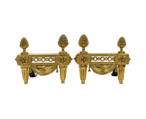 Bouhon Freres Brass Chenets  Empire style having fluted tapered legs, pierced panels, pinecone finials and cast iron stands; 