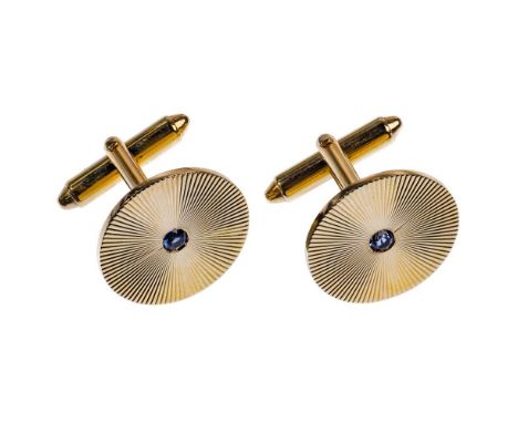 14k Yellow Gold and Sapphire Cufflinks  Having a round cut sapphire in a circular front; marked '14k' and 'KL'; with a storag