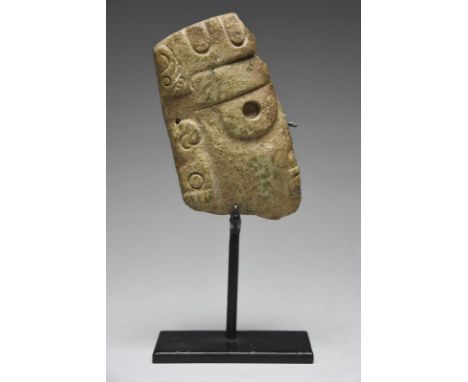 A Mixtec fragment Mexico, circa 800 - 1200 AD jade/greenstone, carved a human face with a jaguar head headdress and the ear a