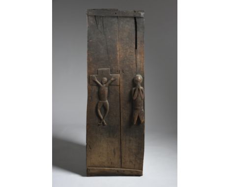 A Holo door Democratic Republic of the Congo of two panels relief carved the Corpus Christi on a part crucifix and a kneeling