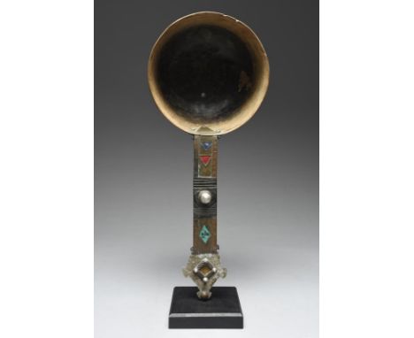 A Tuareg ladle Niger with a deep wood bowl and and aluminium and brass handle with coloured lozenges and triangles, 42.5cm lo
