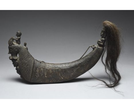 A Batak medicine horn Indonesia carved wood and horn with applied hair, 30cm long. (3) Provenance Ex Professor R. Hicks, OBE,