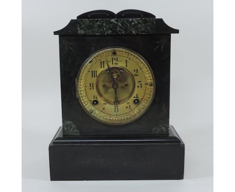 A black slate and marble mantel clock, with a brass dial, 27cm tall