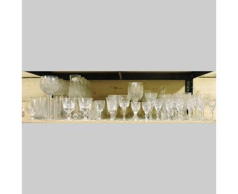 A shelf of cut glass drinking glasses, to include wine and liqueur glasses