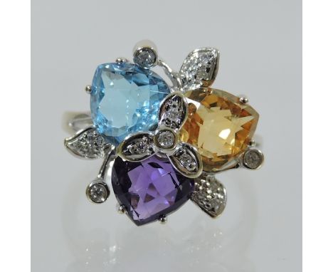 An 18 carat white gold amethyst, topaz, citrine and diamond dress ring, boxed