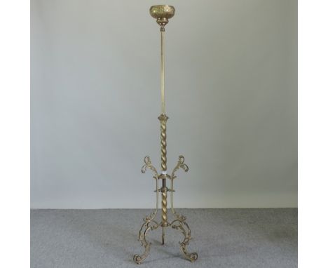 A 19th century gilt brass standing metamorphic torchere / gueridon table, with a spirally turned column, on a tripod base