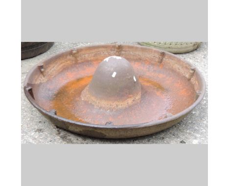 A cast iron circular pig trough, 85cm diameter