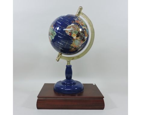 A modern globe, inset with hardstone and semi-precious stones, 44cm tall