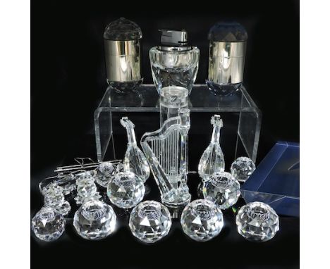 A collection of Swarovski crystal items, to include a table lighter, candleholders, some boxed, largest 9cm tall